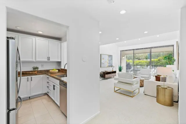 a view of living room with furniture and rug