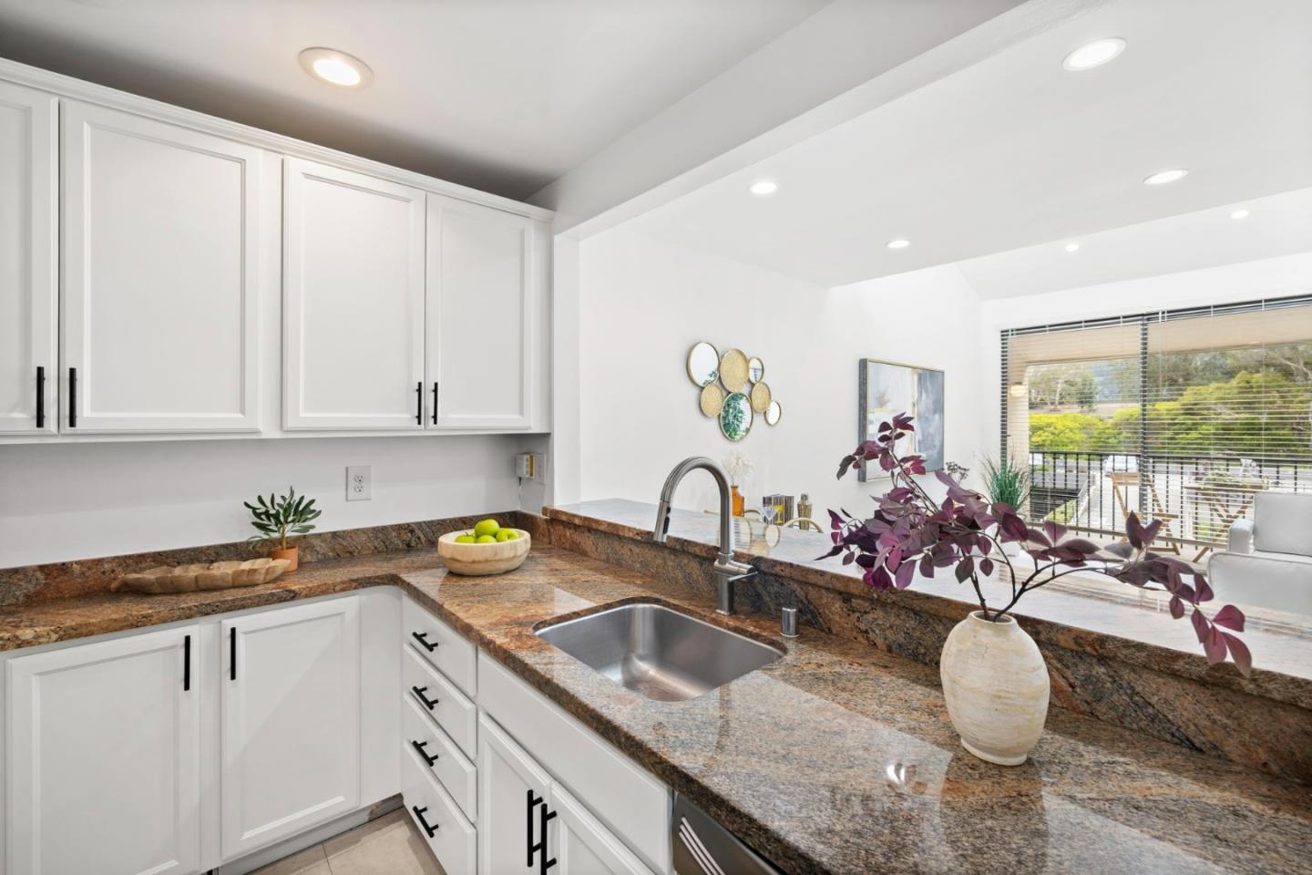 380 Vallejo Drive, Unit 321 Millbrae, CA 94030 - Photo 9 of 38 a kitchen with granite countertop a sink a stove and cabinets