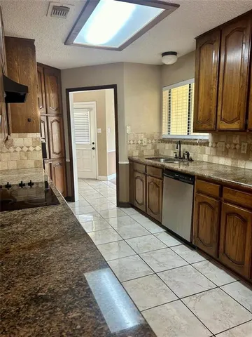 a large bathroom with a sink and a large mirror