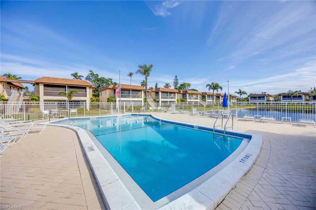 1155 Sandpiper Street, Unit F7 Naples, FL 34102 - Photo 22 of 29 swimming pool view with a outdoor seating space
