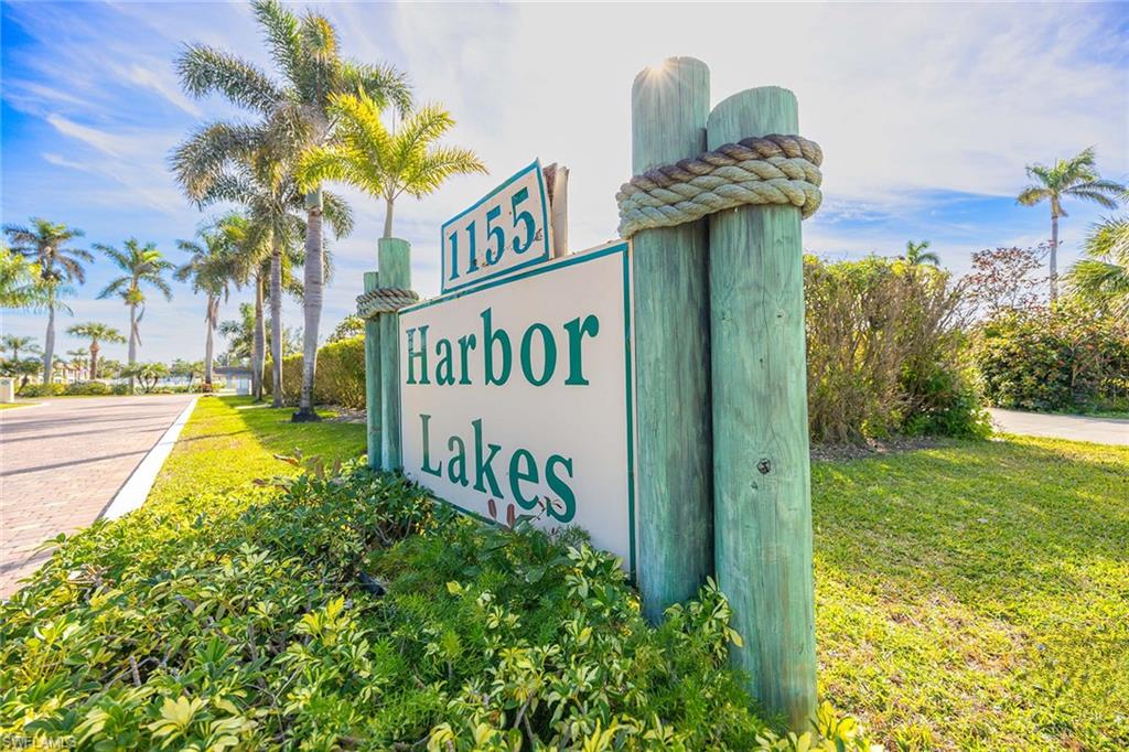 1155 Sandpiper Street, Unit F7 Naples, FL 34102 - Photo 29 of 29 a view of a street with potted plants and palm trees