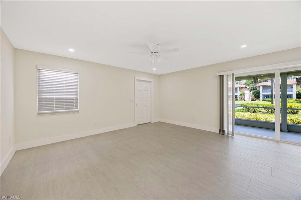 1155 Sandpiper Street, Unit F7 Naples, FL 34102 - Photo 6 of 29 an empty room with windows