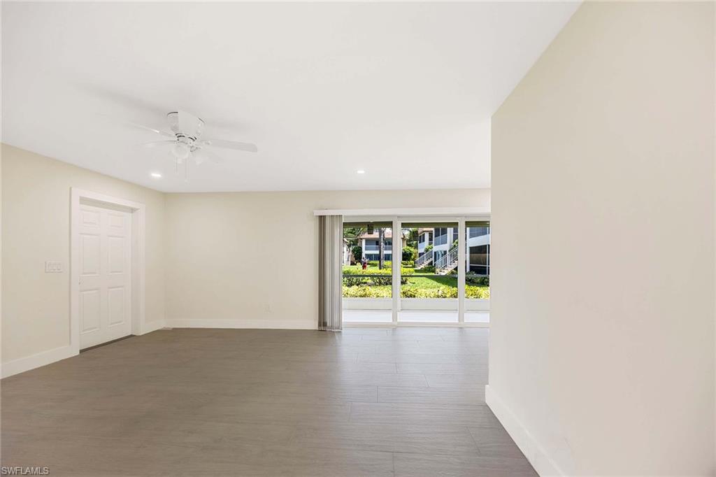 1155 Sandpiper Street, Unit F7 Naples, FL 34102 - Photo 7 of 29 an empty room with ceiling fan and window