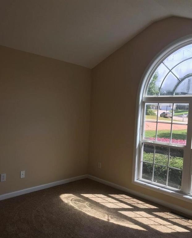 436 Abbey Place Villa Rica, GA 30180 - Photo 11 of 12 an empty room with wooden floor and windows