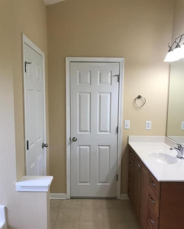 436 Abbey Place Villa Rica, GA 30180 - Photo 8 of 12 a bathroom with a sink a toilet and shower
