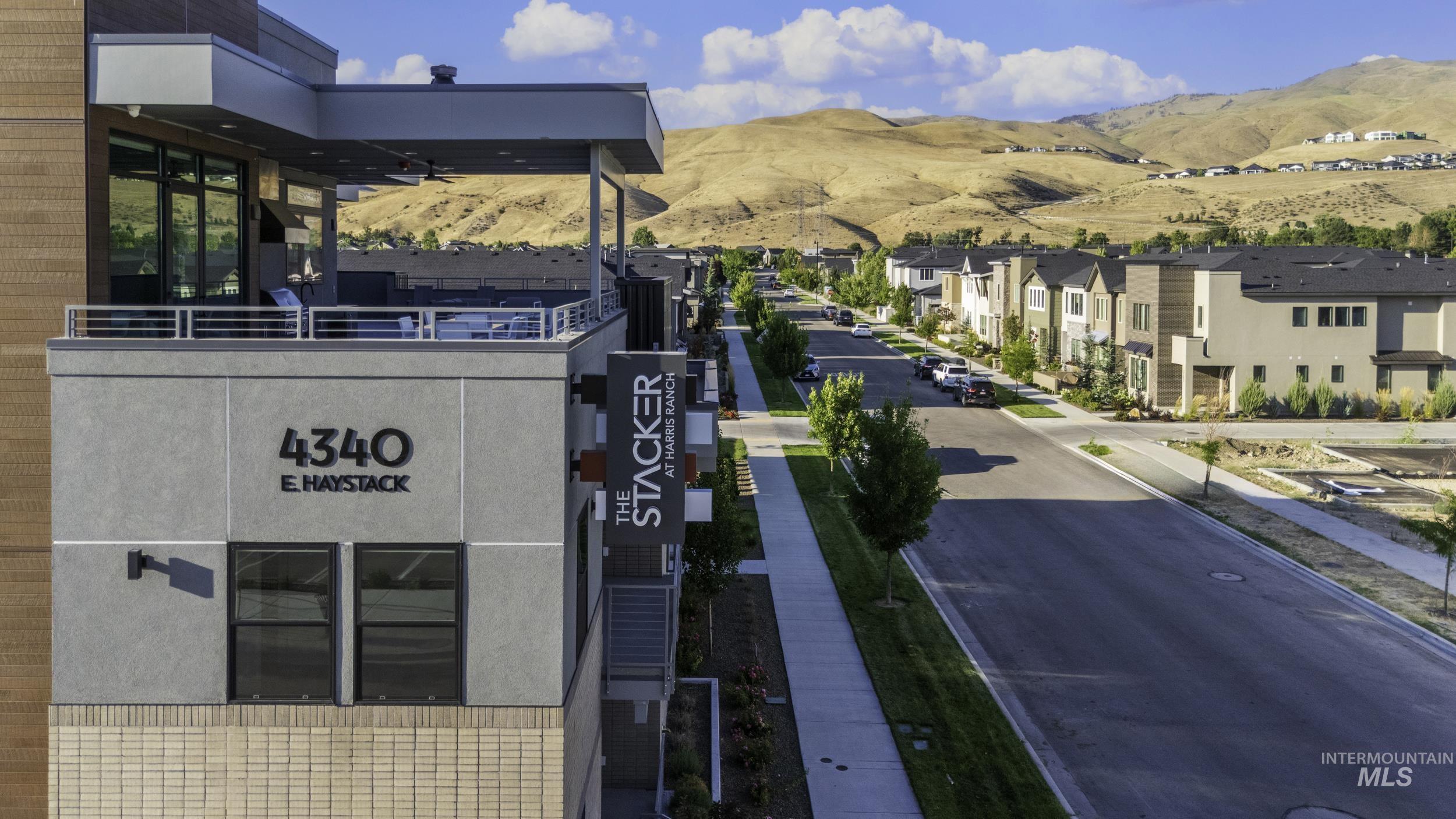 4340 East Haystack Street, Unit 307 Boise, ID 83716 - Photo 1 of 50 View of building exterior with a mountain view