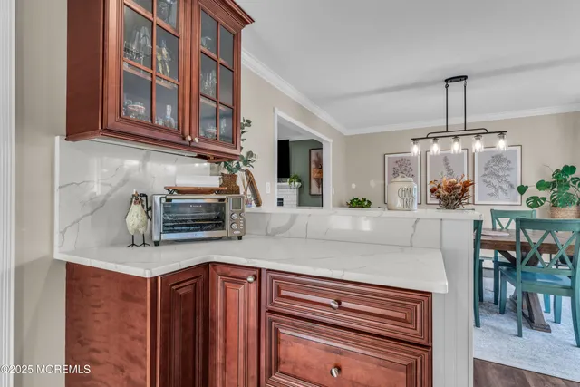 a kitchen with stainless steel appliances granite countertop a sink and cabinets