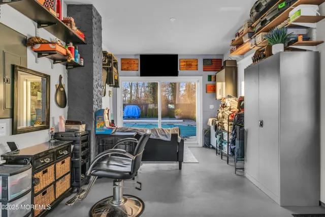 a view of a livingroom with furniture and a flat screen tv