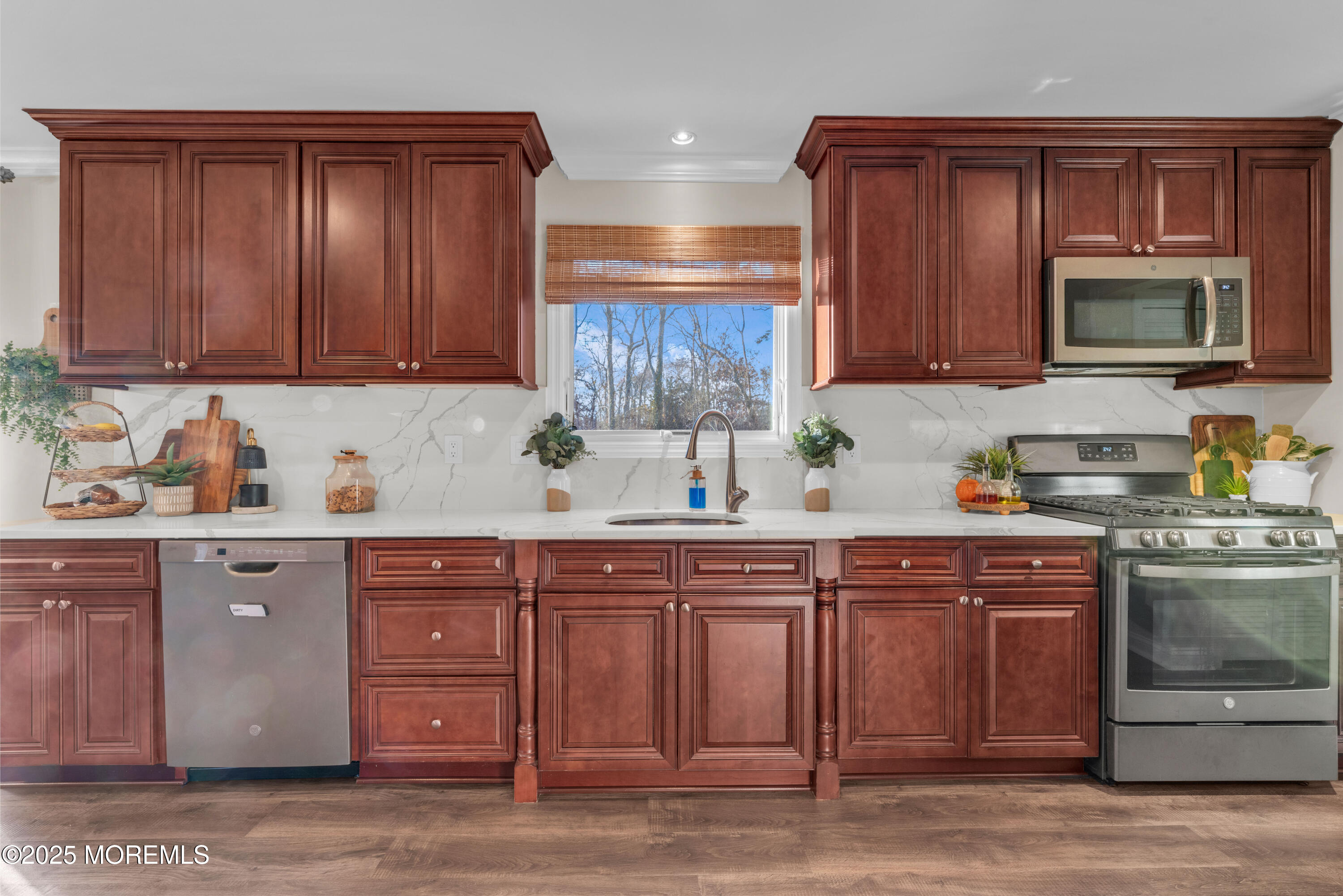 636 Donald Street Brick, NJ 08723 - Photo 7 of 32 a kitchen with stainless steel appliances granite countertop wooden cabinets a stove top oven a sink and dishwasher