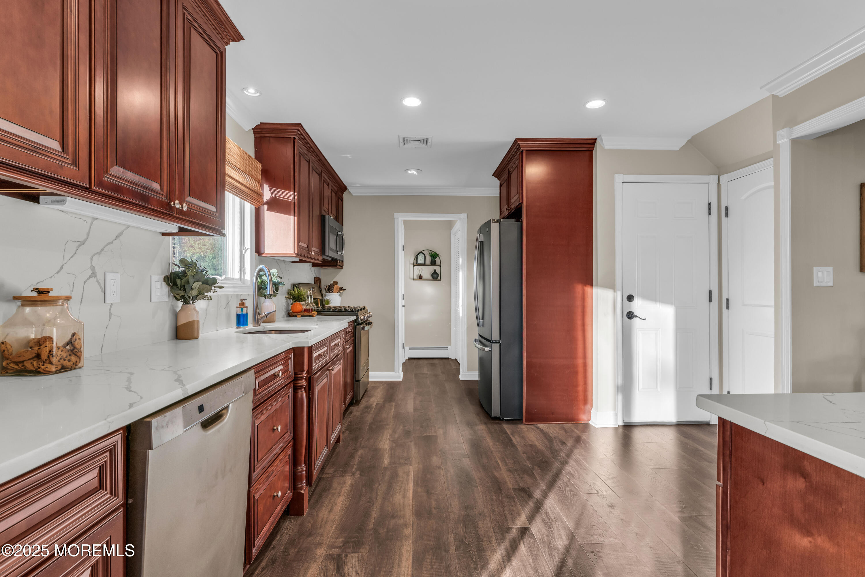 636 Donald Street Brick, NJ 08723 - Photo 8 of 32 a kitchen with stainless steel appliances granite countertop a refrigerator a sink dishwasher and a stove with wooden floor
