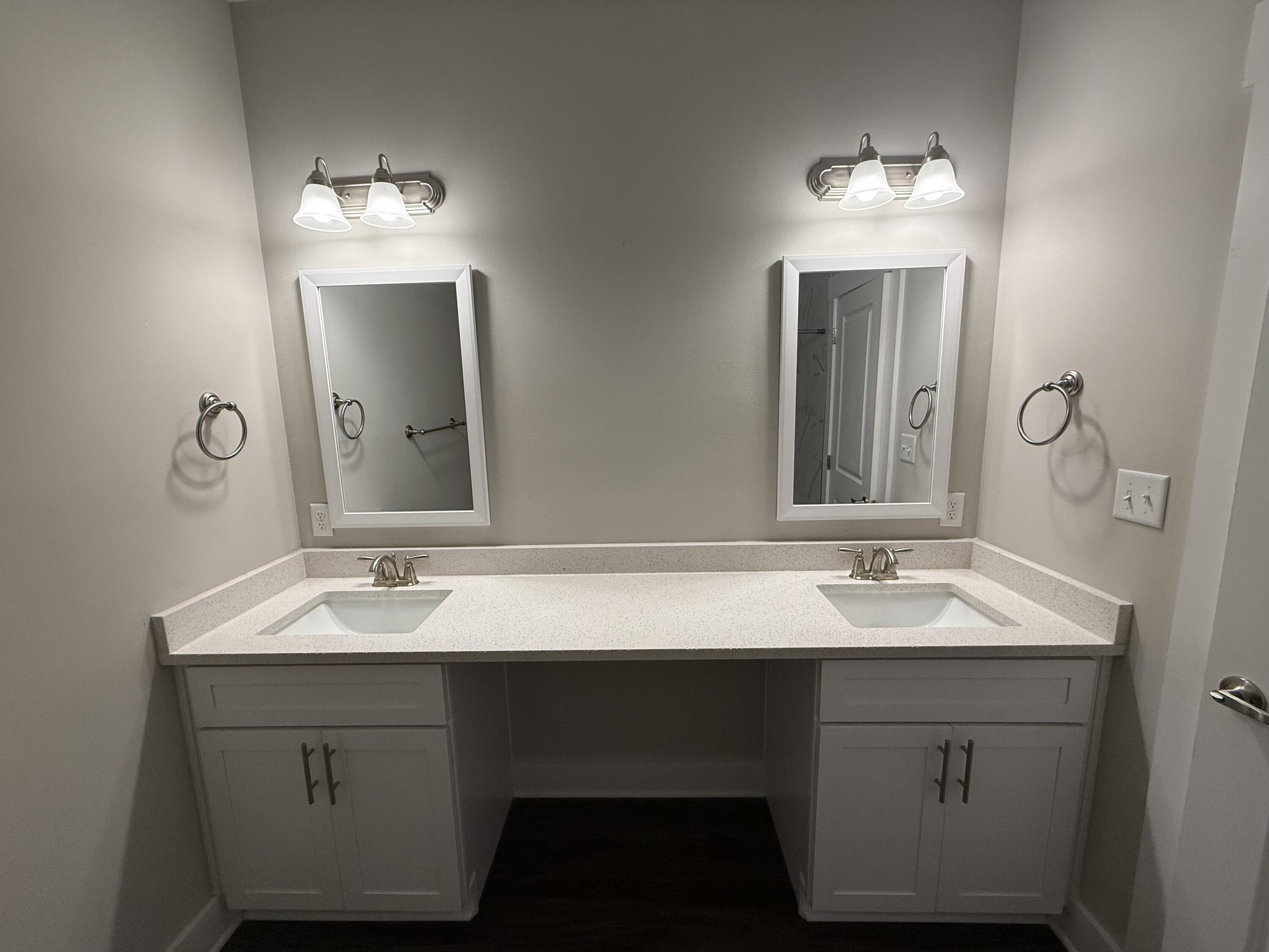 202 Date Palm Lane Freeport, FL 32439 - Photo 21 of 21 a bathroom with a double vanity sink and a mirror