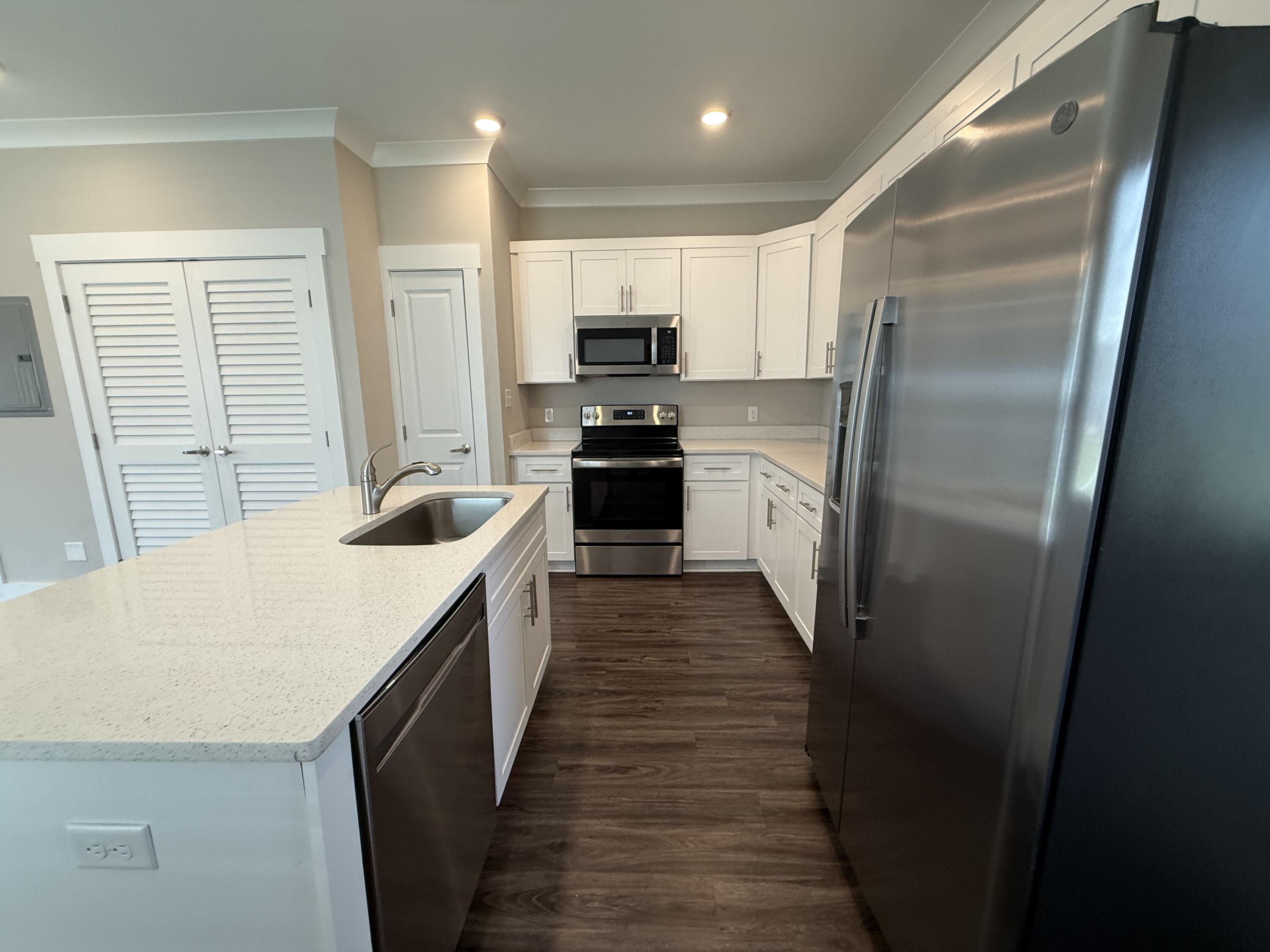 202 Date Palm Lane Freeport, FL 32439 - Photo 8 of 21 a large kitchen with a stove and refrigerator