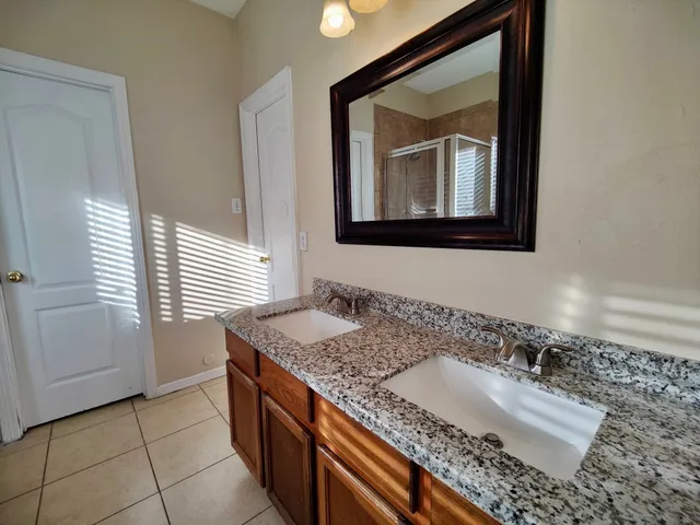 a bathroom with a sink a vanity and a mirror