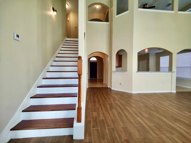 a view of an entryway with wooden floor