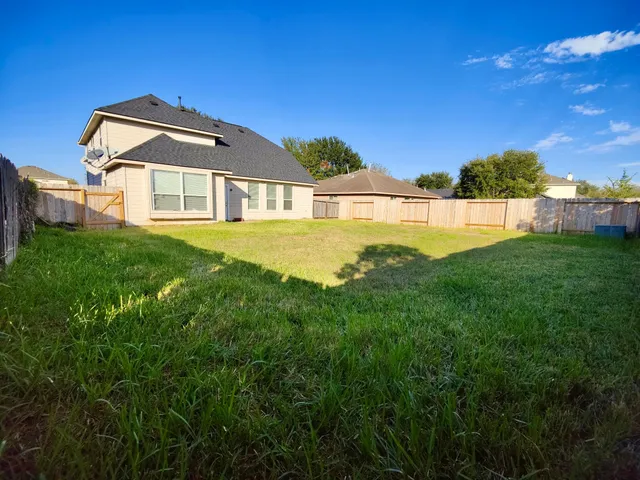 a view of a house with a big yard