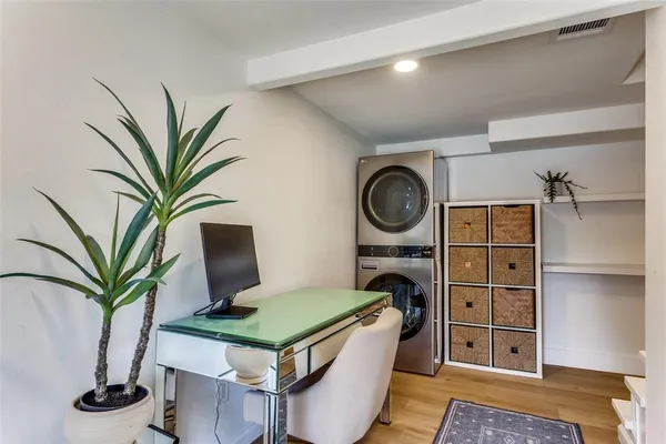 a living room with a couch and a chandelier