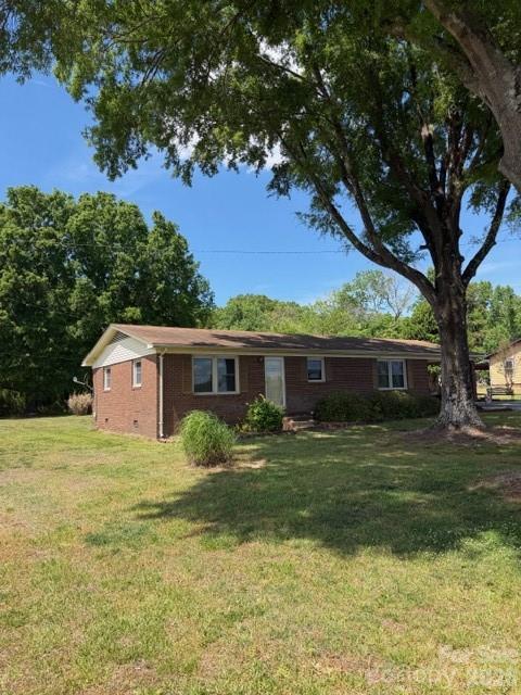 20415 Efird Road Albemarle, NC 28001 - Photo 14 of 16 a front view of house with yard and trees