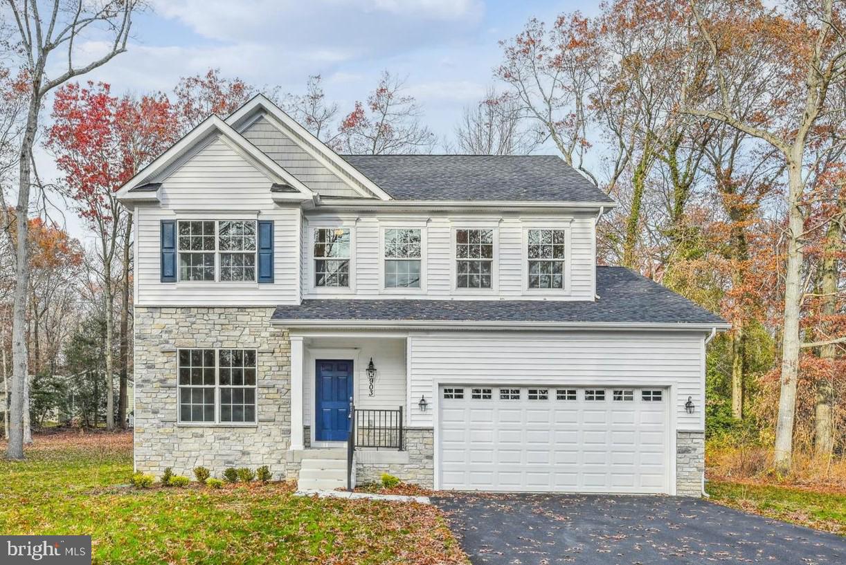 13814 Pecan Ridge Way Bowie, MD 20715 - Photo 1 of 14 a front view of a house with a yard