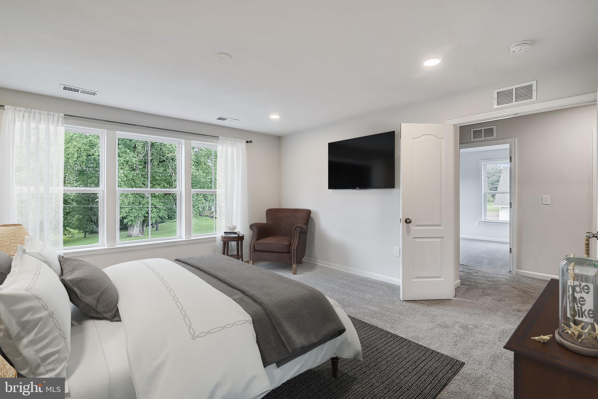 13814 Pecan Ridge Way Bowie, MD 20715 - Photo 14 of 14 a bedroom with a bed and a television