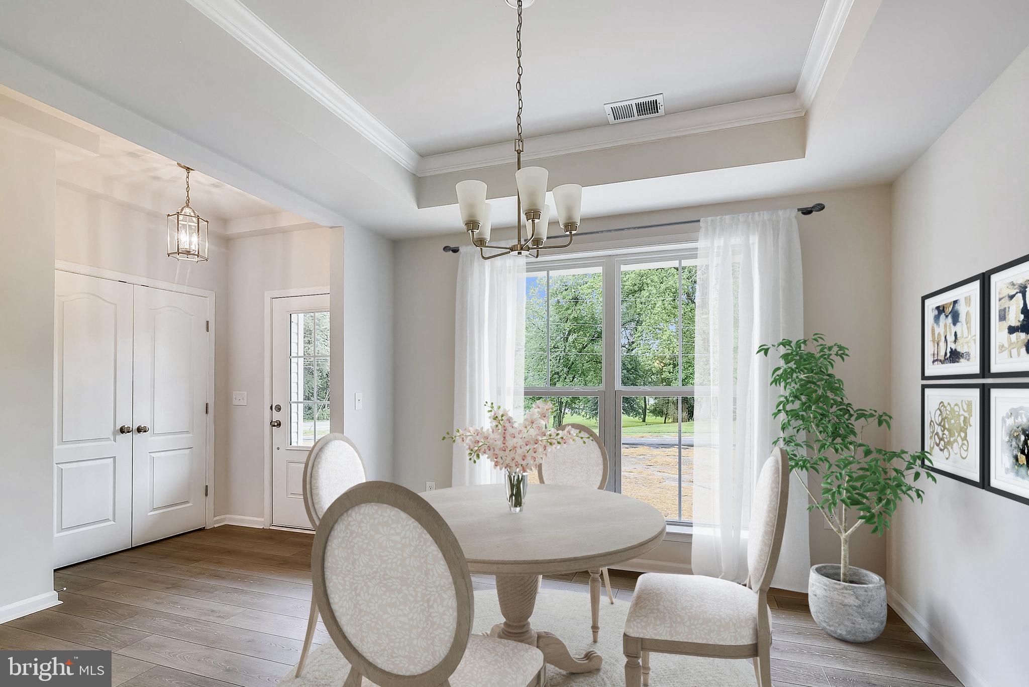 13814 Pecan Ridge Way Bowie, MD 20715 - Photo 2 of 14 a dining room with chandelier and wooden floor