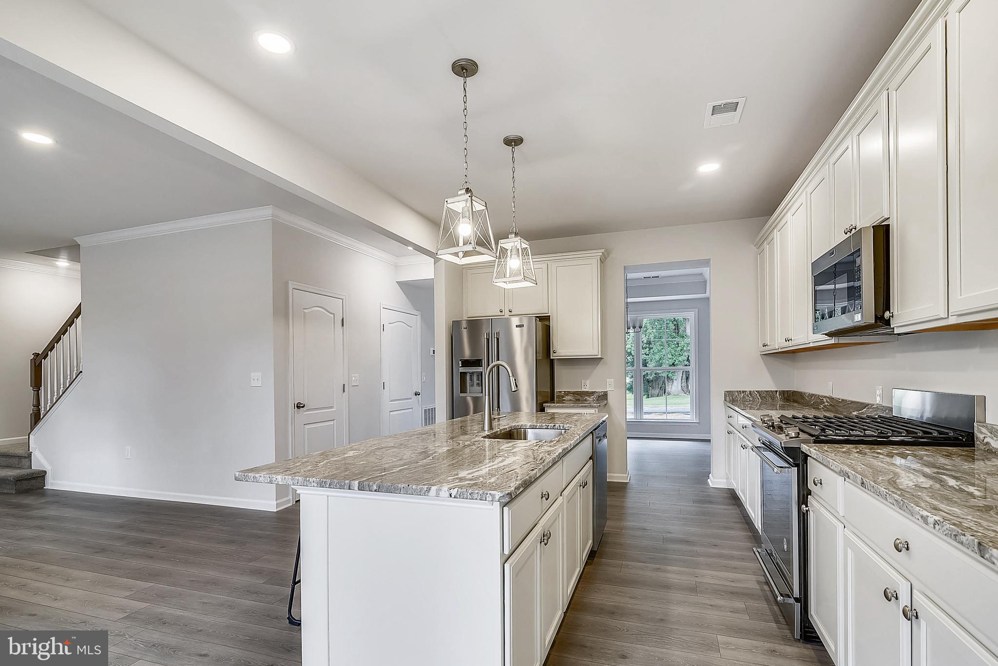 13814 Pecan Ridge Way Bowie, MD 20715 - Photo 4 of 14 a kitchen with granite countertop a sink stove and refrigerator