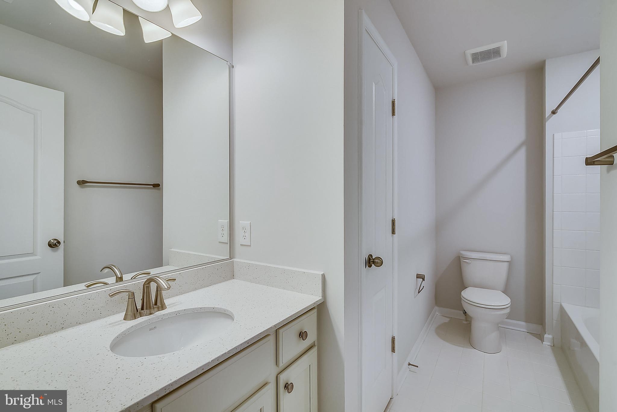 13814 Pecan Ridge Way Bowie, MD 20715 - Photo 7 of 14 a bathroom with a sink toilet and shower