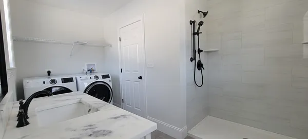 a utility room with dryer and washer