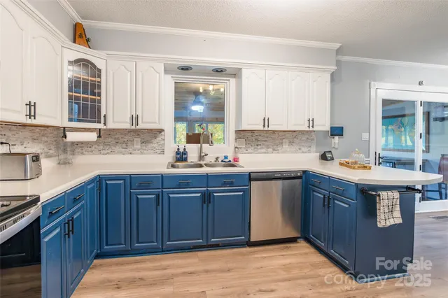 a kitchen with stainless steel appliances granite countertop wooden cabinets a sink and dishwasher