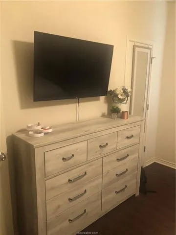 a bedroom with a bed and a view of en suite