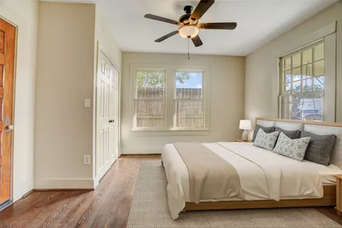 a bedroom with a large bed and a window