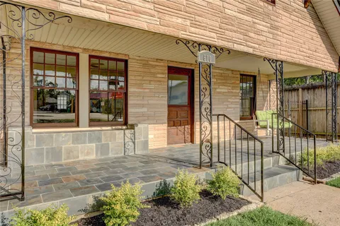 a front view of a house with a porch