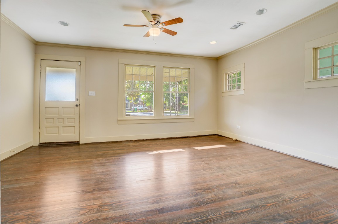 610 Columbia Street Houston, TX 77007 - Photo 10 of 24 a view of an empty room with a window and wooden floor