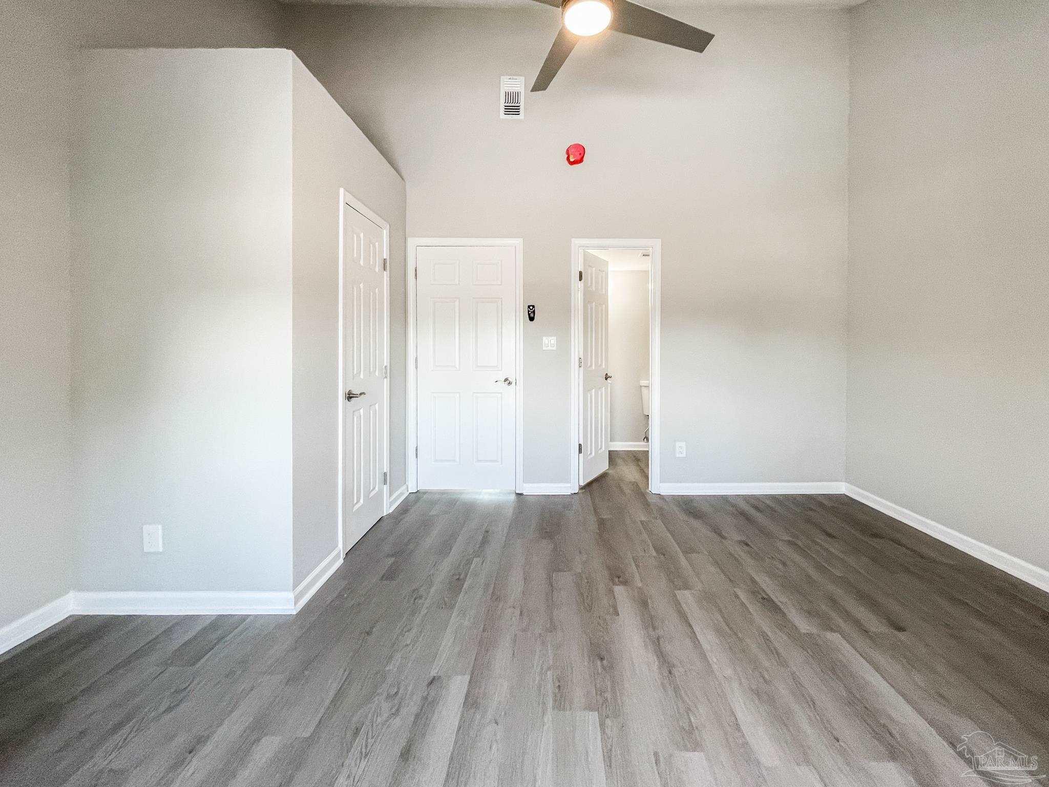 7200 Sharp Reef, Unit 2 Pensacola, FL 32507 - Photo 15 of 24 wooden floor in an empty room