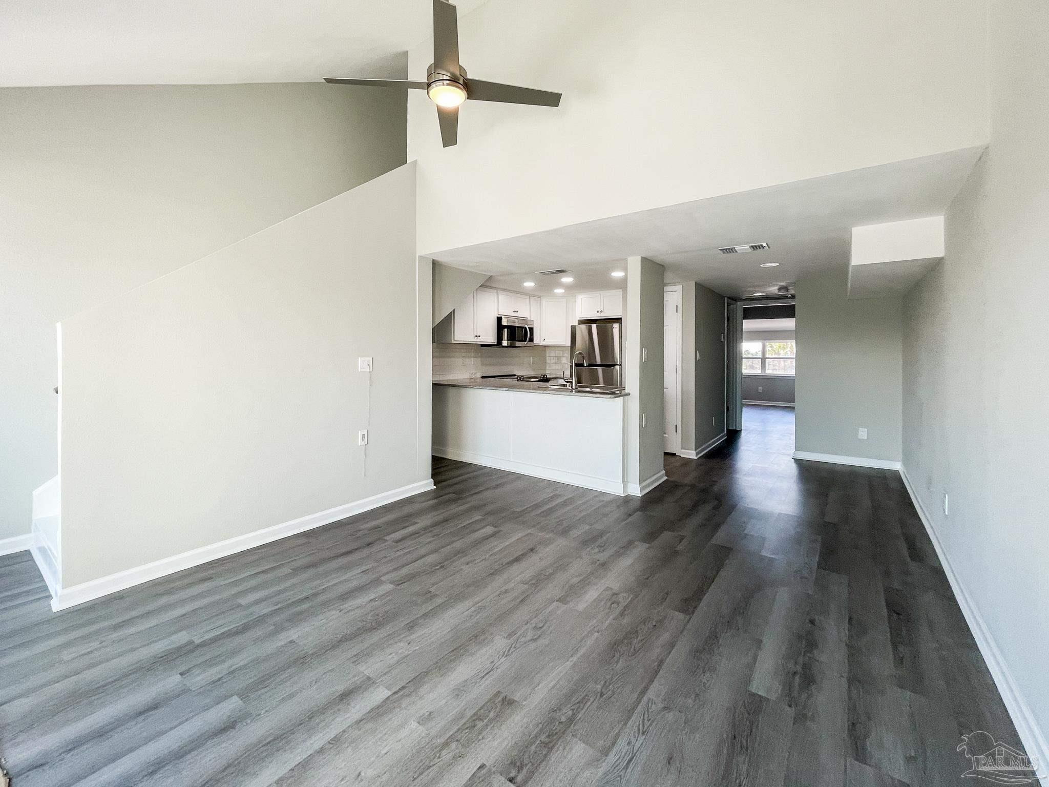 7200 Sharp Reef, Unit 2 Pensacola, FL 32507 - Photo 5 of 24 a view of a hallway with wooden floor