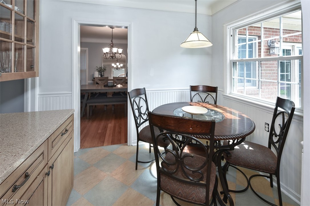 2559 Channing Road Cleveland, OH 44118 - Photo 7 of 28 Dining space with plenty of natural light, a chandelier, light hardwood / wood-style flooring, and ornamental molding