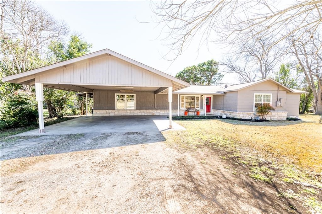 7305 Forest Wood Road Austin, TX 78745 - Photo 25 of 25 a front view of a house with a yard and garage
