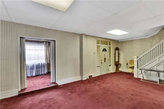 a view of an empty room with glass door