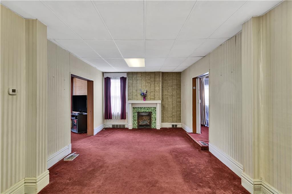 733 North Warren Avenue Apollo, PA 15613 - Photo 8 of 29 a view of an empty room with a fireplace and a window