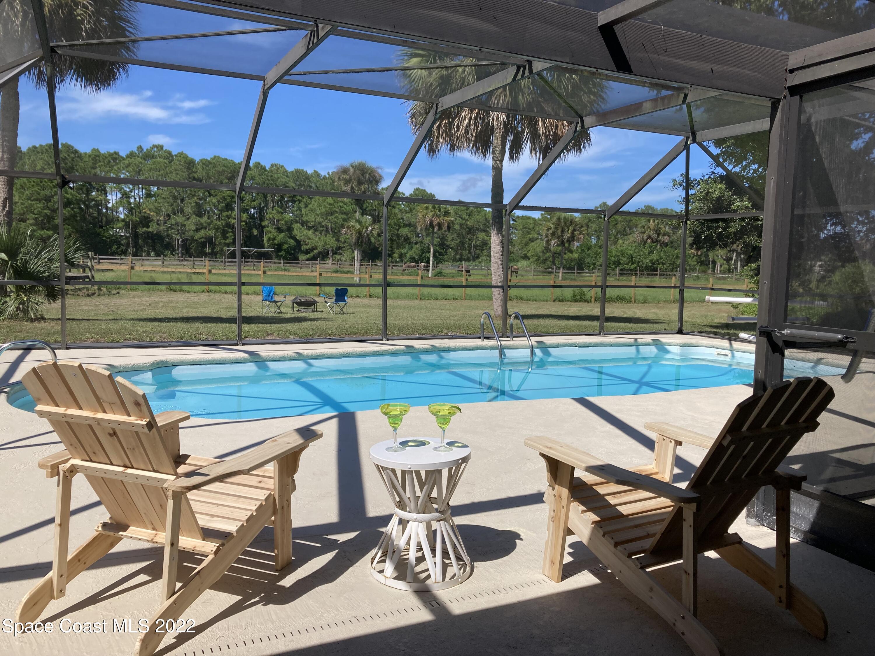 2005 Cox Road Cocoa, FL 32926 - Photo 2 of 35 screen pool view of pastures