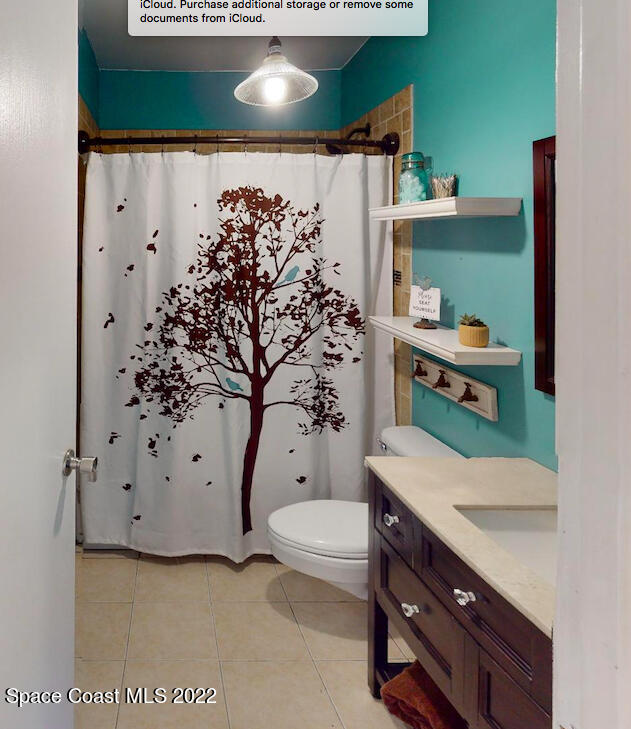 2005 Cox Road Cocoa, FL 32926 - Photo 24 of 35 a bathroom with a bathtub sink and toilet