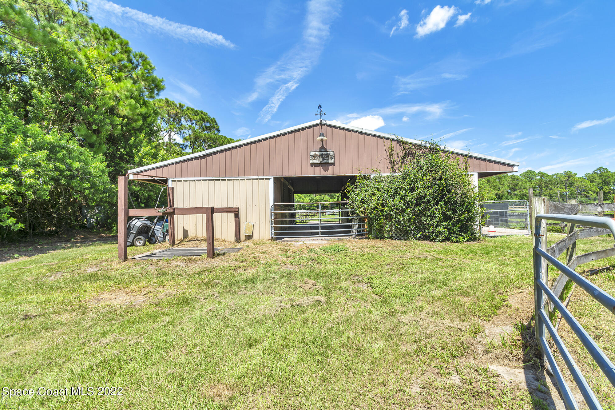 2005 Cox Road Cocoa, FL 32926 - Photo 30 of 35 a front view of house with yard and trees in the background