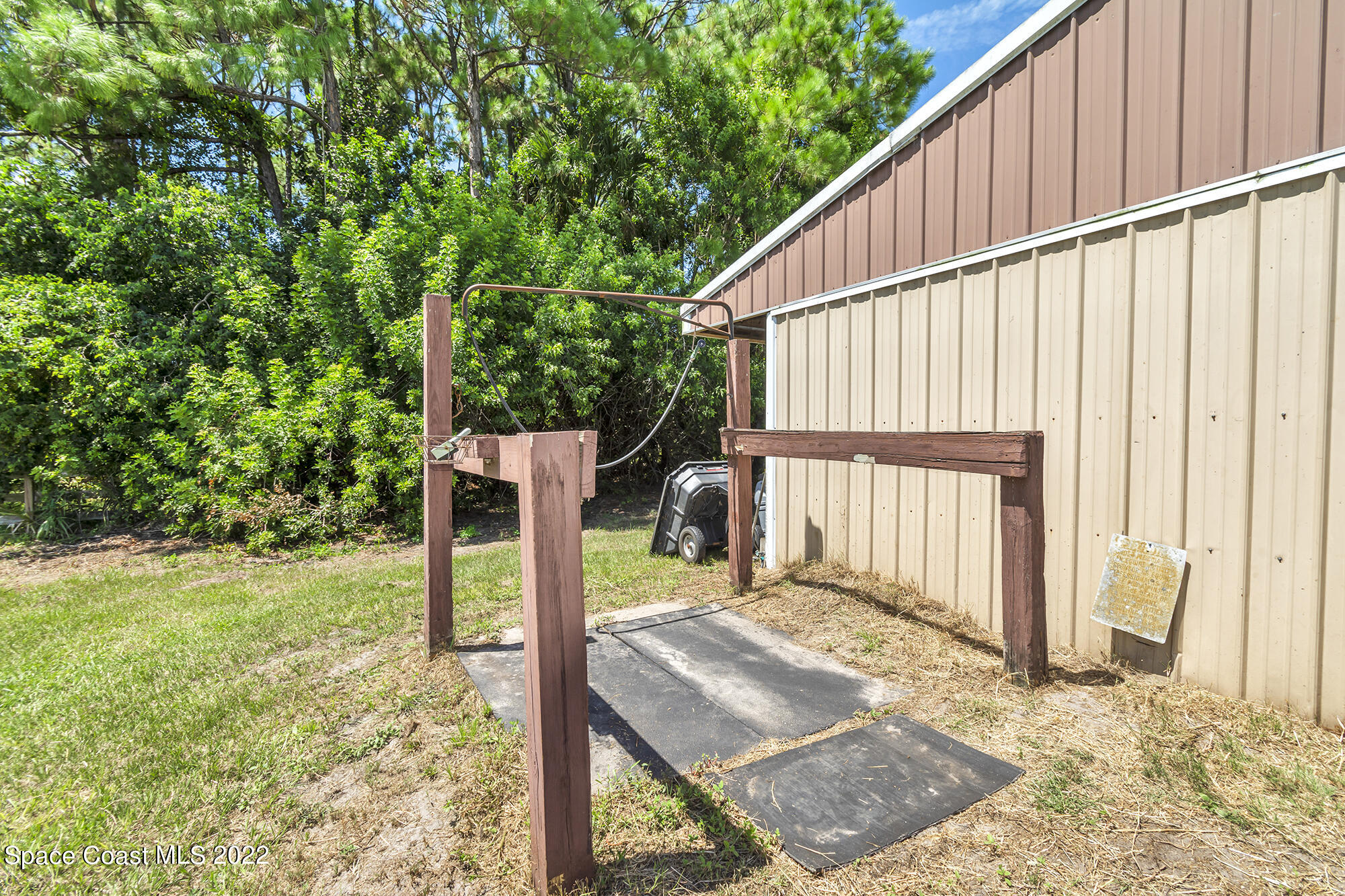 2005 Cox Road Cocoa, FL 32926 - Photo 10 of 35 a backyard of a house with wooden floor and fence