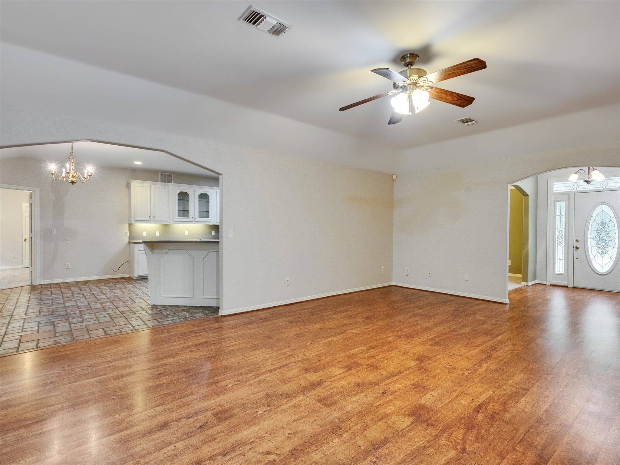 195 Coral Gables Trinity, TX 75862 - Photo 27 of 50 a view of an empty room with window and wooden floor