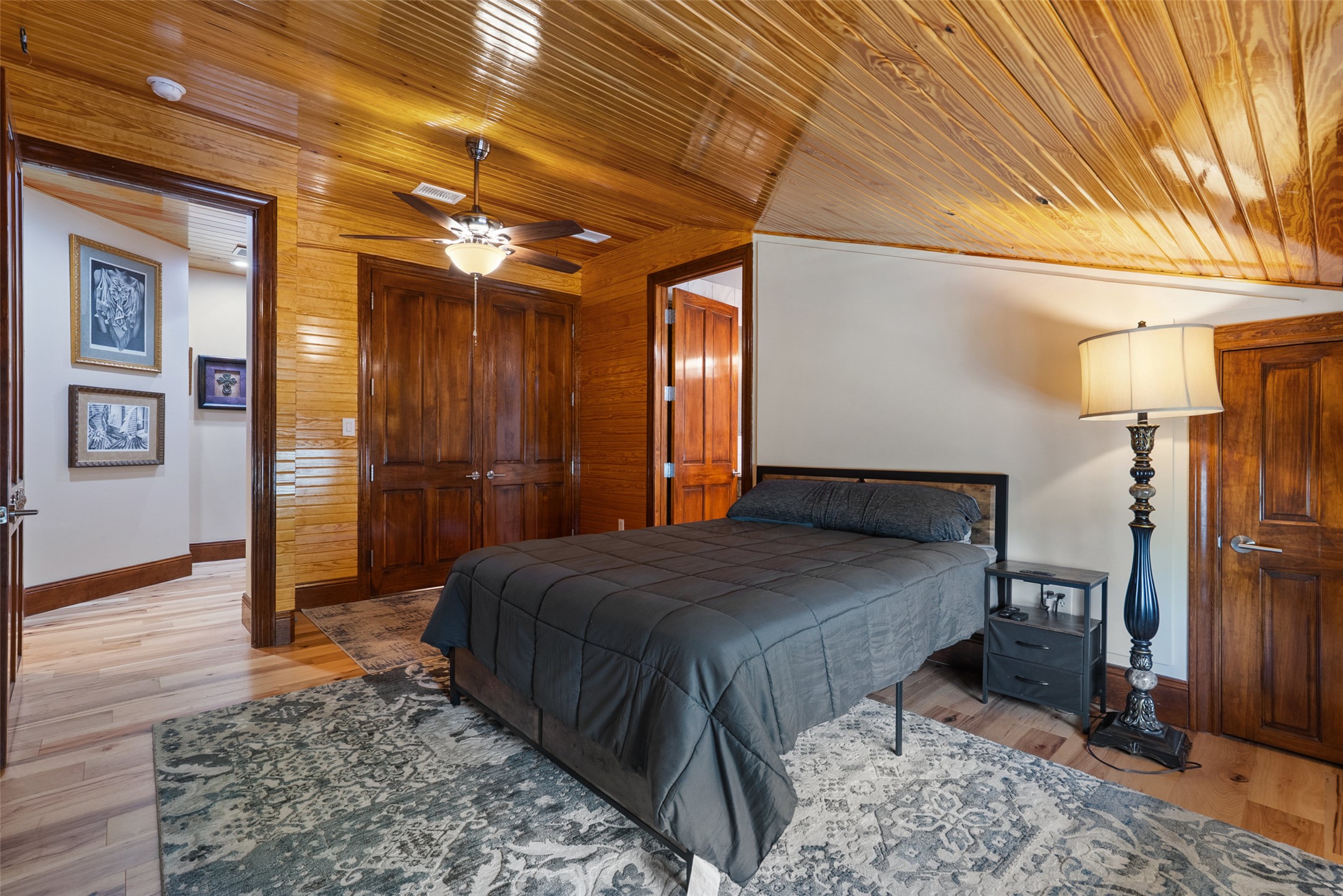 15303 Faubion Trail Leander, TX 78641 - Photo 15 of 39 a bedroom with a bed and a table