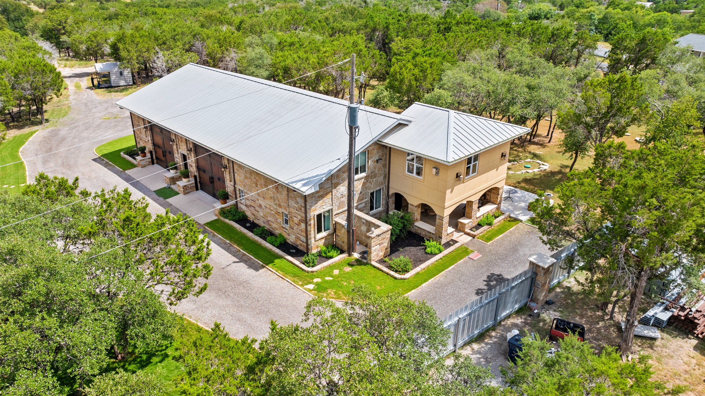 15303 Faubion Trail Leander, TX 78641 - Photo 24 of 39 an aerial view of a house with a big yard and large trees