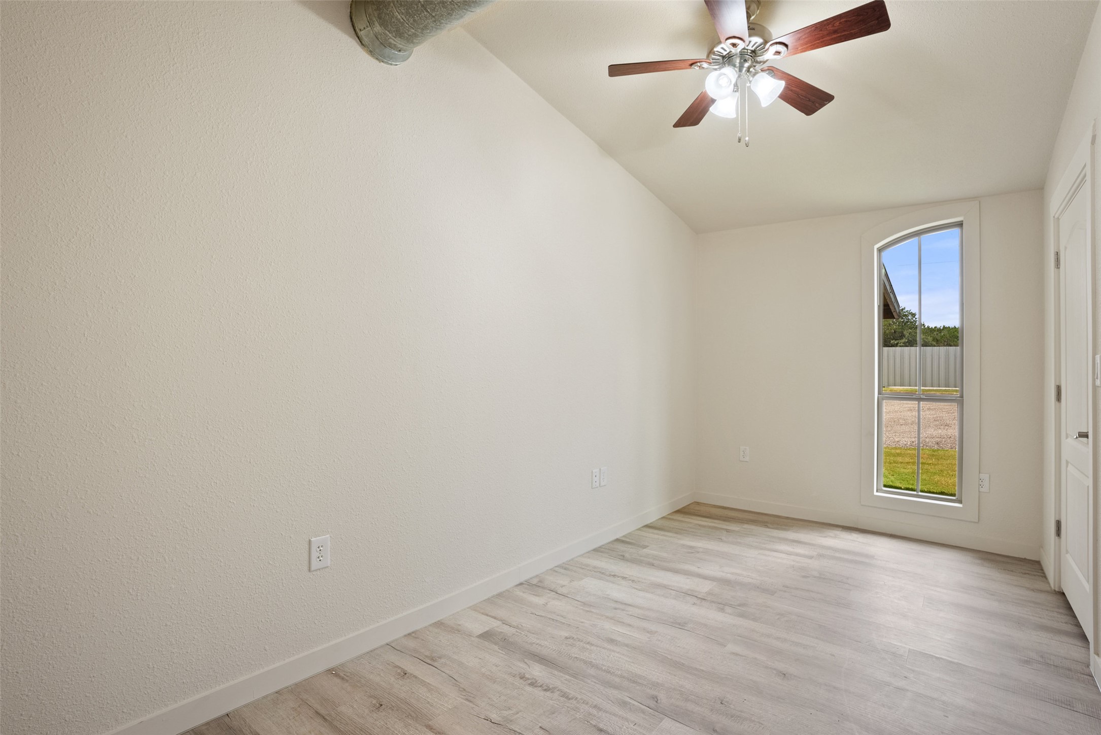 15303 Faubion Trail Leander, TX 78641 - Photo 34 of 39 wooden floor in an empty room with a window
