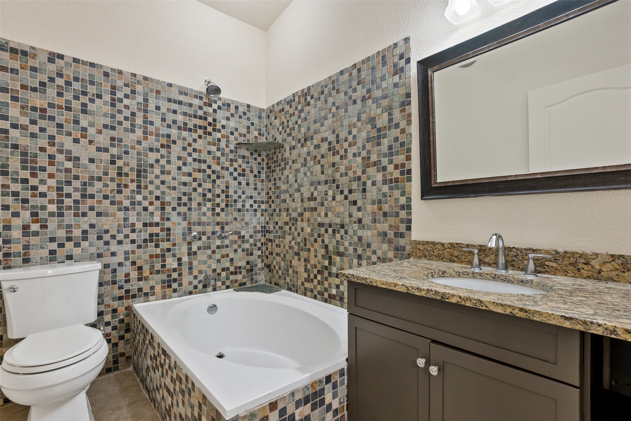 15303 Faubion Trail Leander, TX 78641 - Photo 35 of 39 a bathroom with a sink a toilet and a mirror