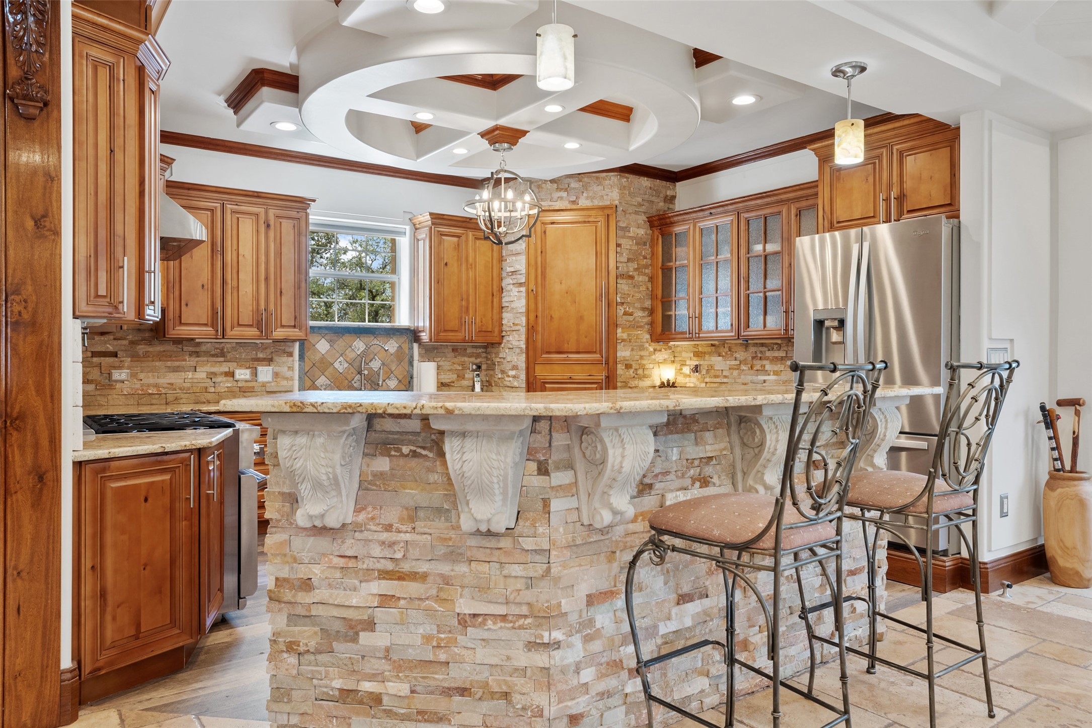 15303 Faubion Trail Leander, TX 78641 - Photo 6 of 39 a dining hall with stainless steel appliances kitchen island granite countertop a table and chairs in it