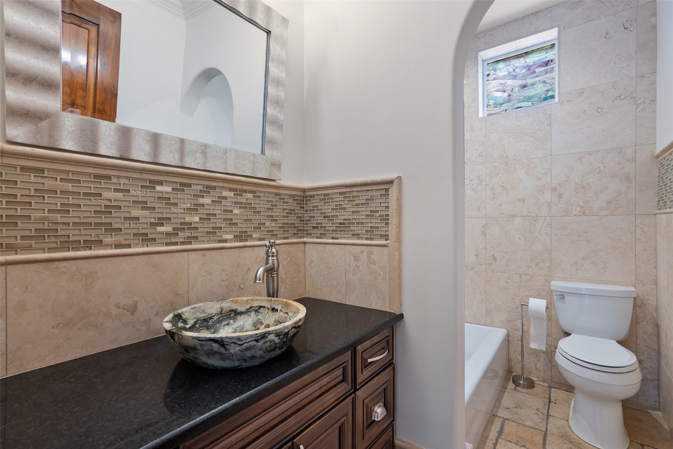 15303 Faubion Trail Leander, TX 78641 - Photo 9 of 39 a bathroom with a toilet and a sink
