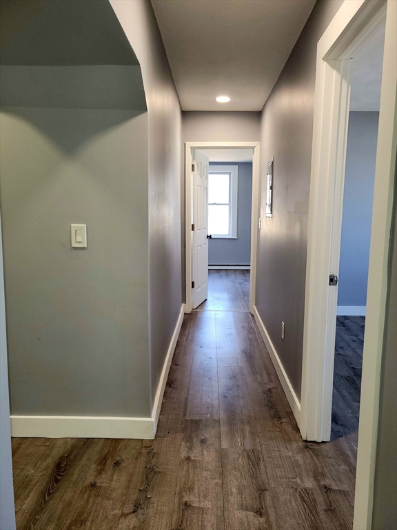 136 Commonwealth Road Wayland, MA 01778 - Photo 19 of 27 a view of a hallway with wooden floor